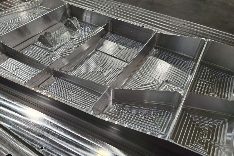 Shown in the image is the sample component containing milled pockets of different geometries.